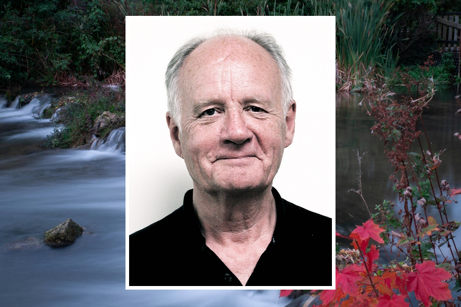 A profile picture of Dr. Paul Helm, with a photo of a river near his home in England in the background.